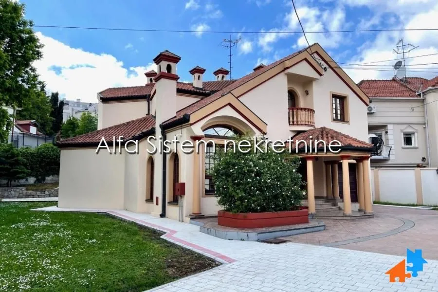 Exterior view of the house with a landscaped yard and terrace.