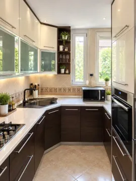Small kitchen with built-in cabinetry and a white countertop. - image 5