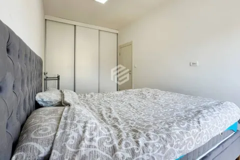 Bedroom with a double bed and a built-in wardrobe. - image 9