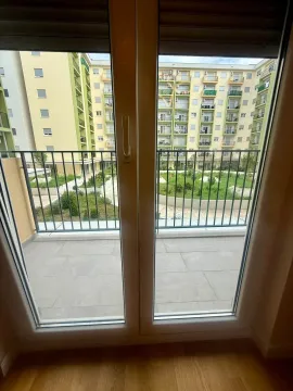 View from the terrace overlooking the courtyard and surrounding residential buildings. - image 9