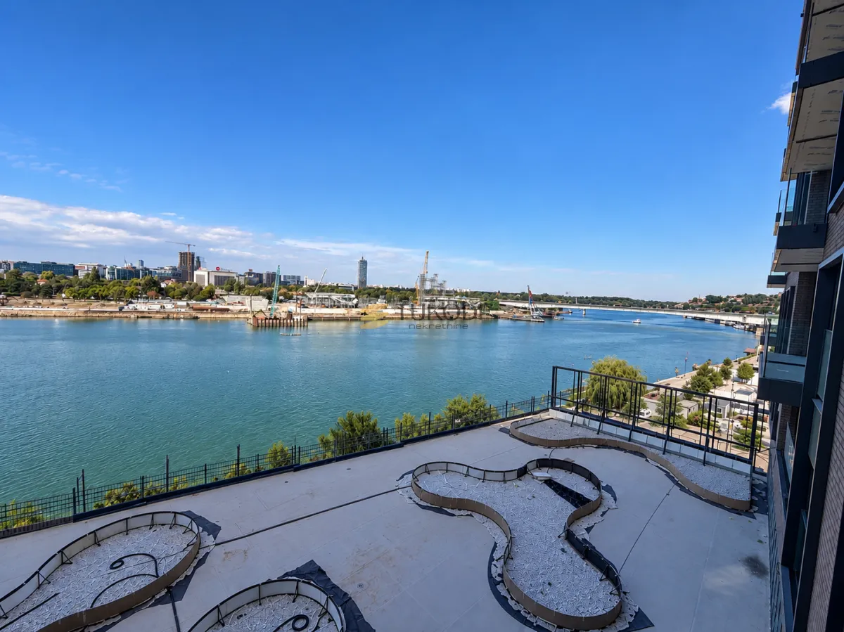 Large terrace with a view of the river and the city.