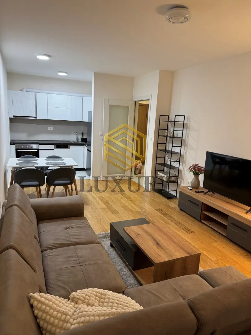 Living room connected to the kitchen and dining area.