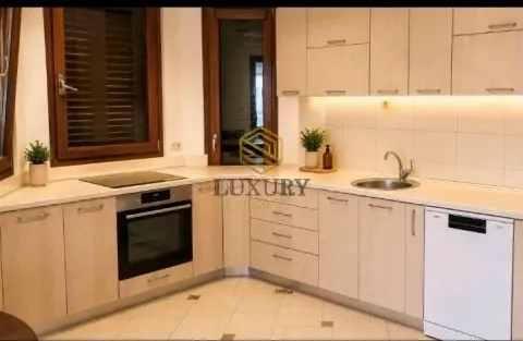 Bright and equipped kitchen with wooden elements. - image 3