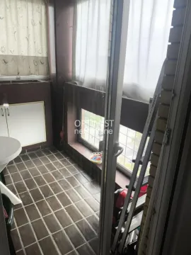 Enclosed balcony with ceramic floor tiles and windows. - image 8