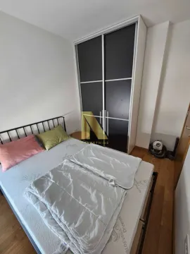 Bedroom with a double bed and a large fitted wardrobe. - image 5