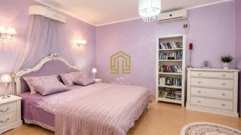 Bright bedroom in purple tones with a large bed. - image 8