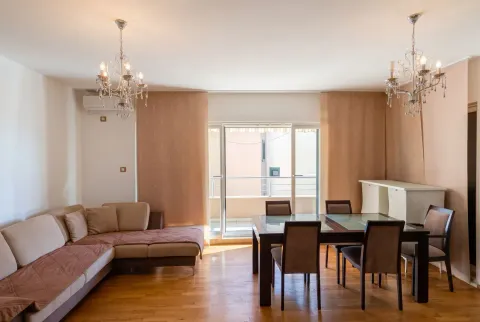 Spacious living room with a sofa set and a dining table. - image 2