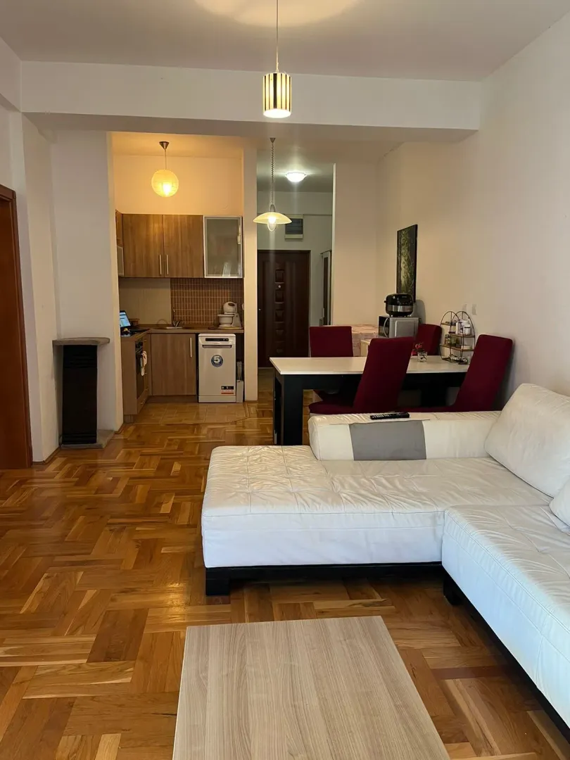 Living room with dining area and open passage to the kitchen.
