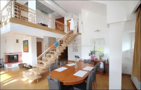 Spacious living room with a dining area, staircase, and an upper-level gallery. - image 11