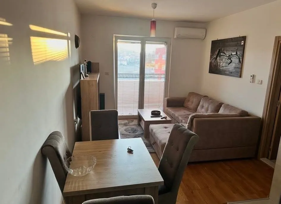 Living room with dining area and sofa set.