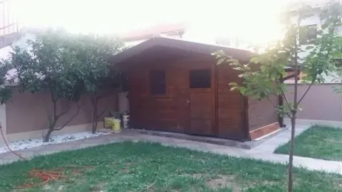 Backyard with a wooden shed. - image 3