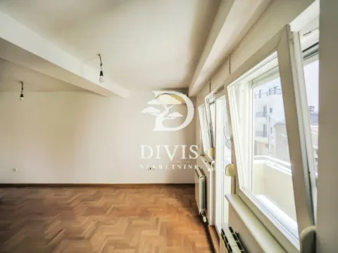 Empty room with parquet flooring and open windows. - image 16