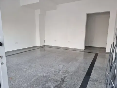 Empty bright room with tiled flooring and white walls. - image 2