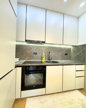 Modern kitchen with built-in units and appliances. - image 8