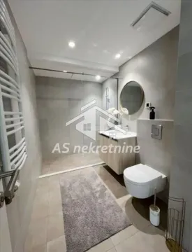 Modern bathroom with a walk-in shower, washbasin, and toilet. - image 10