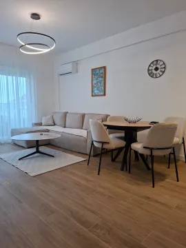 Living room with a sofa set and a dining table. - image 2