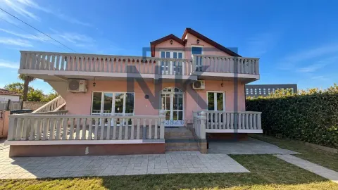 Exterior view of the house with terraces and yard. - image 2