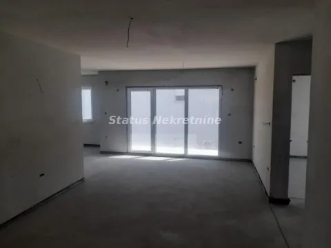 Unfurnished room under construction with large windows. - image 3
