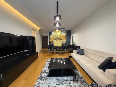 Living room with sofa and dining area in the background. - image 4