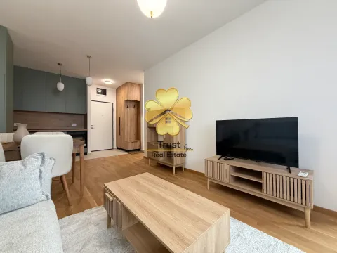 Living room with sofa, TV and dining area. - image 4