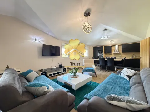 Spacious living room with a sofa set and a dining area in the background. - image 4