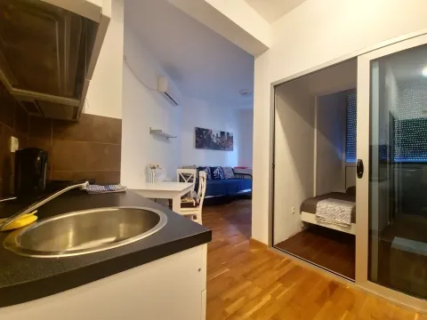 View from the kitchen towards the dining area and living room in the apartment. - image 5