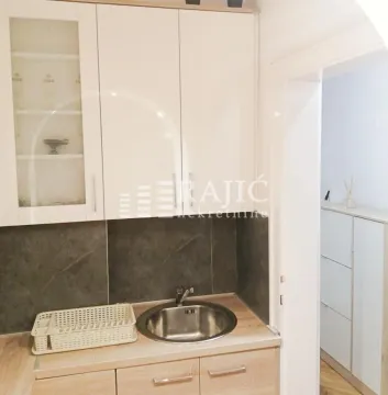 Small kitchen with sink, cabinets and countertop. - image 6