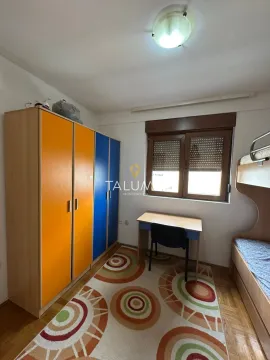 Children's room with a bunk bed, colourful wardrobe and a desk. - image 10