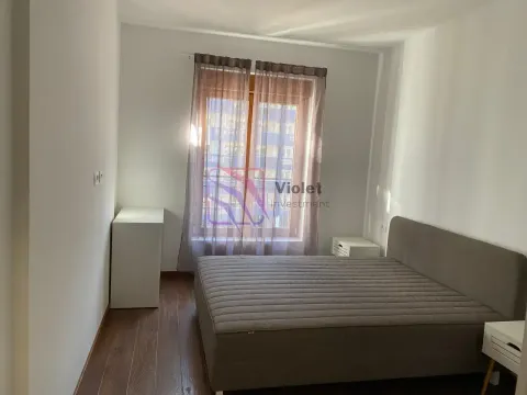 Bedroom with a double bed and a window with curtains. - image 8