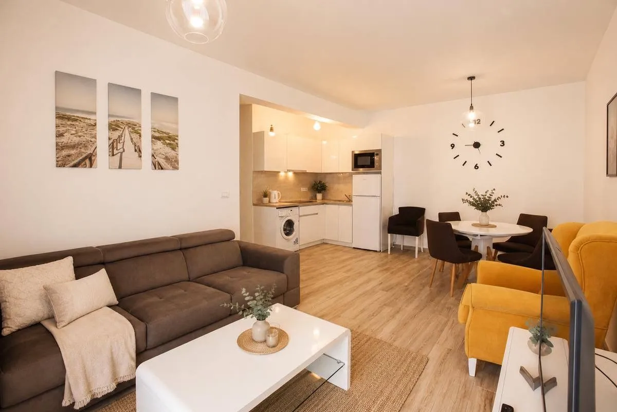 Living room connected with dining area and kitchen.