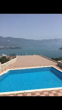 Swimming pool with a view of the sea and mountains. - image 2