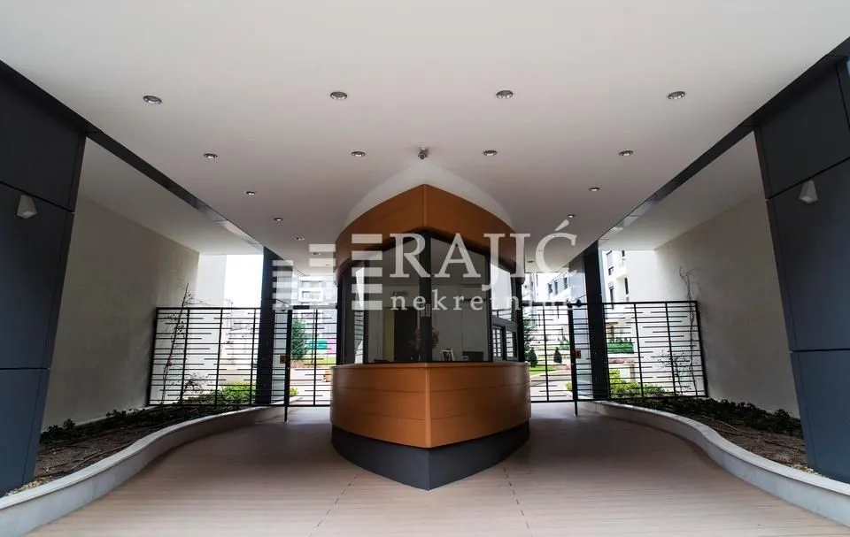 Entrance to a residential building with a security desk.