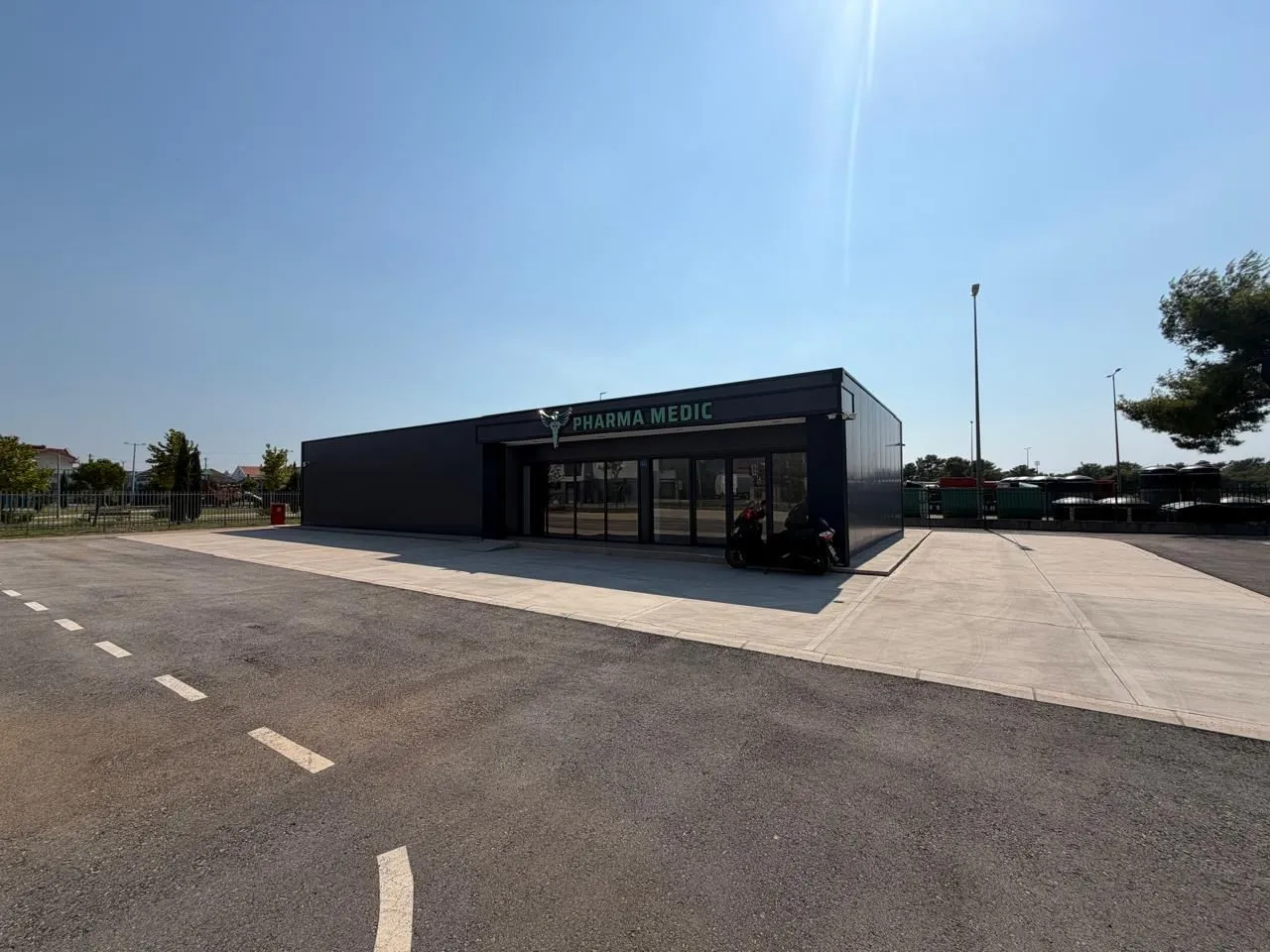 Exterior of a modern commercial building with parking.