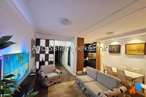 Living room with sofa set, television, and dining table. - image 4