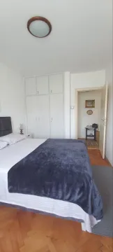 Bedroom with a double bed and a built-in wardrobe. - image 6