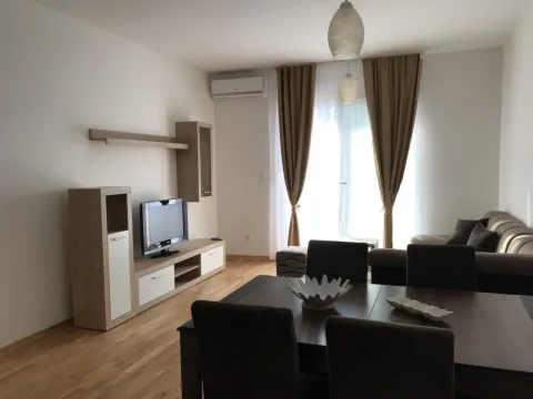 Bright living room with a dining table and seating area. - image 5