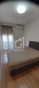 Bedroom with a double bed and access to the terrace. - image 3