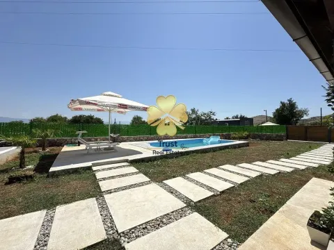 Yard of the house with a swimming pool and parasol. - image 4