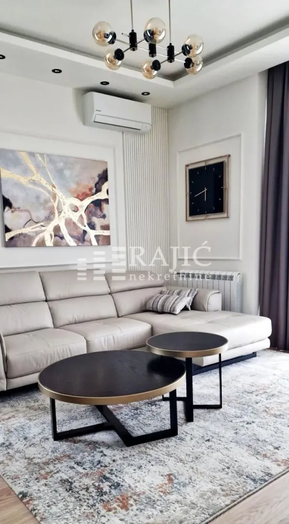 Modern and tidy living room with a sofa and coffee table.