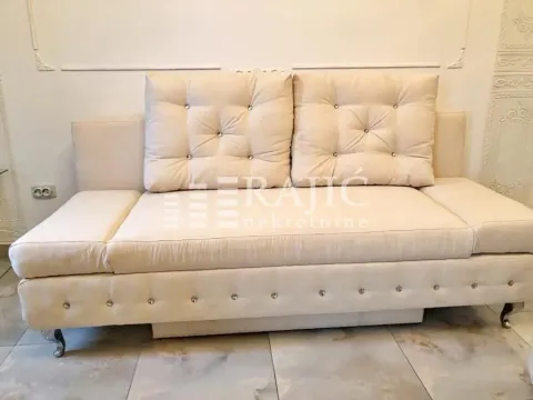 Beige sofa with cushions in the living room. - image 5