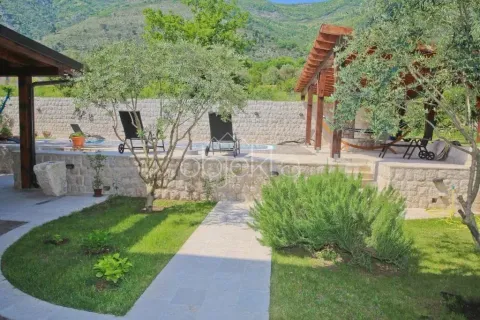 Yard with a swimming pool, landscaped lawn and hills view. - image 7