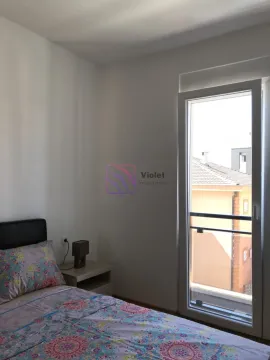 Bedroom with a bed and access to the terrace. - image 17