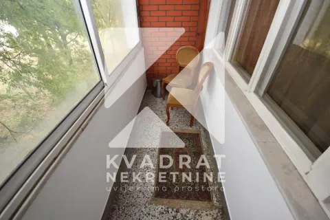 Enclosed balcony with chairs and flooring. - image 14