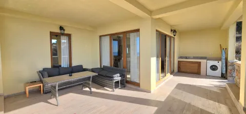 Spacious covered terrace with seating furniture and summer kitchen. - image 8