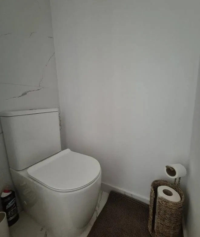 View of a modern bathroom equipped with a toilet.