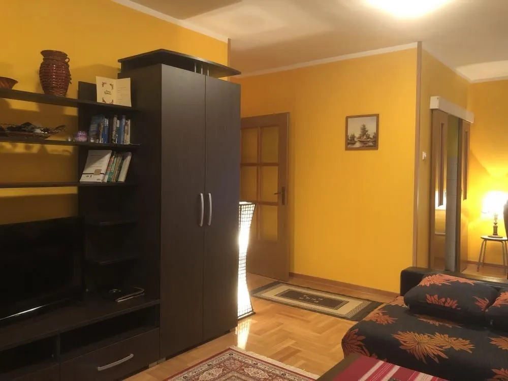Living room with furniture and yellow walls.