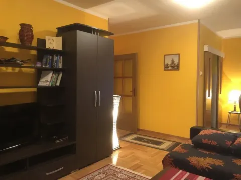 Living room with furniture and yellow walls. - image 4