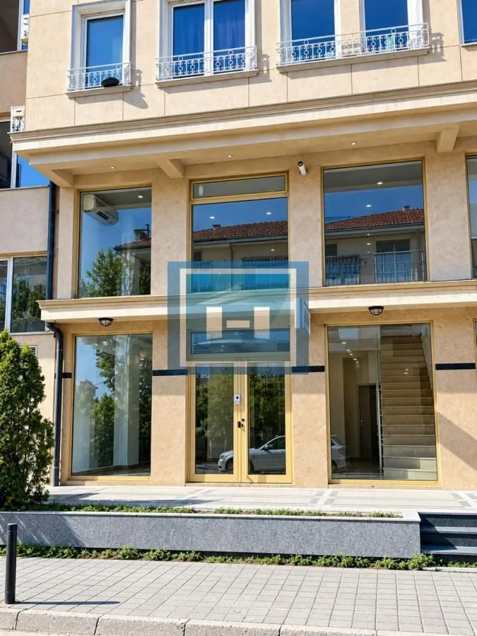 Facade and entrance of a commercial space with large glass display windows.