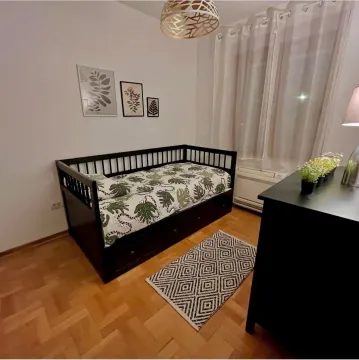 Children's bedroom with a bed, dresser, and parquet flooring. - image 9
