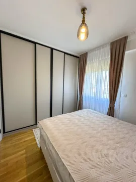 Bright bedroom with a large wardrobe and a double bed. - image 6